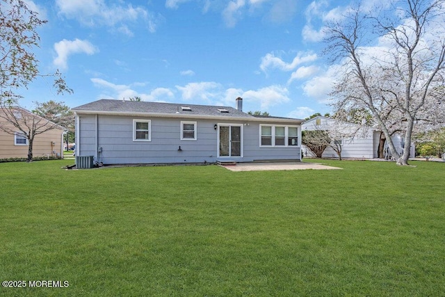 back of property featuring a patio area, a yard, and cooling unit