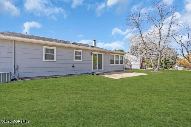 back of property featuring a lawn, central AC unit, and a patio