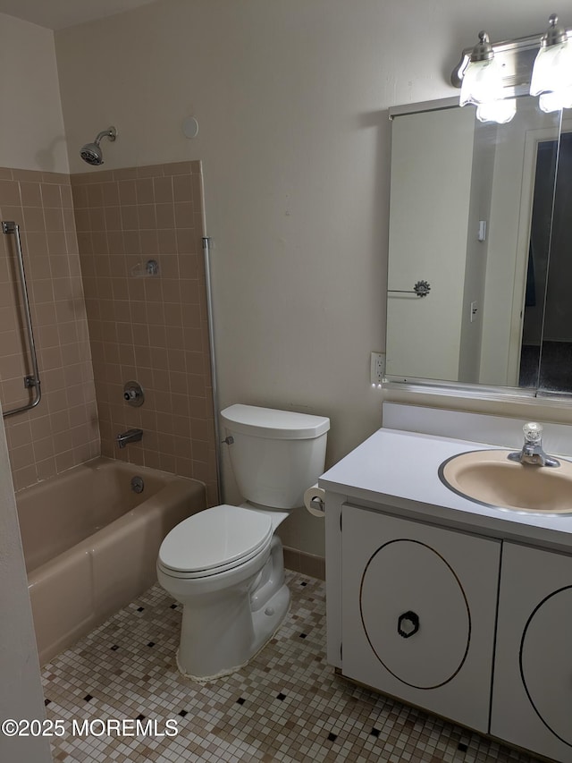 full bath featuring tile patterned floors, vanity, toilet, and tub / shower combination