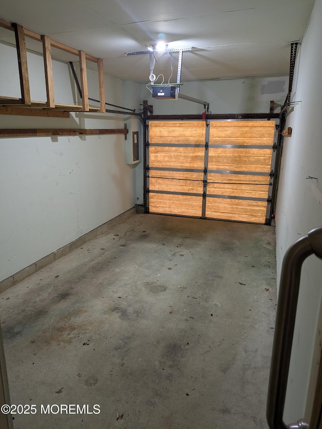 garage featuring a garage door opener and electric panel