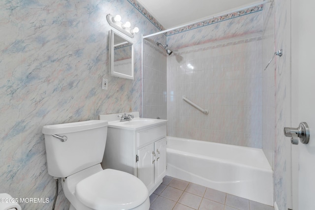 full bathroom with tile patterned flooring, washtub / shower combination, toilet, and vanity