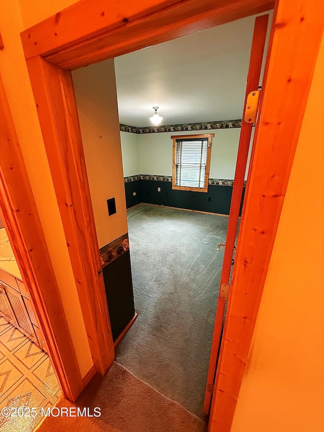 hallway featuring carpet flooring