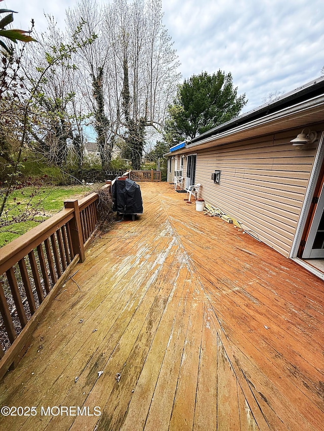 wooden terrace with grilling area