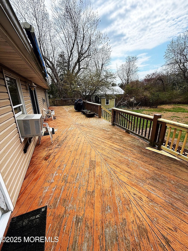 deck with cooling unit and an outdoor structure