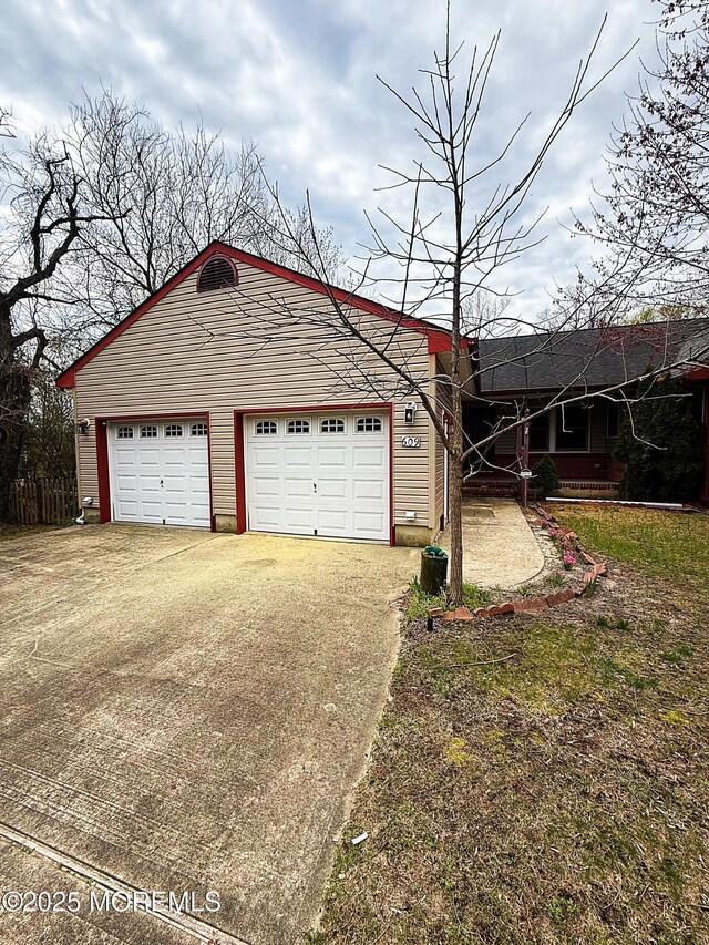 garage featuring driveway