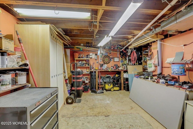 unfinished basement with a workshop area