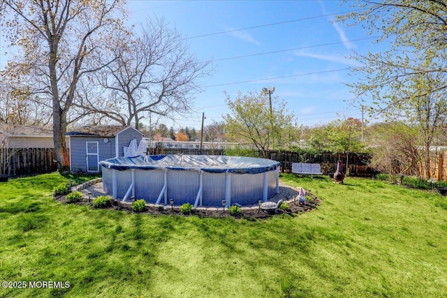 view of yard with a fenced in pool and a fenced backyard