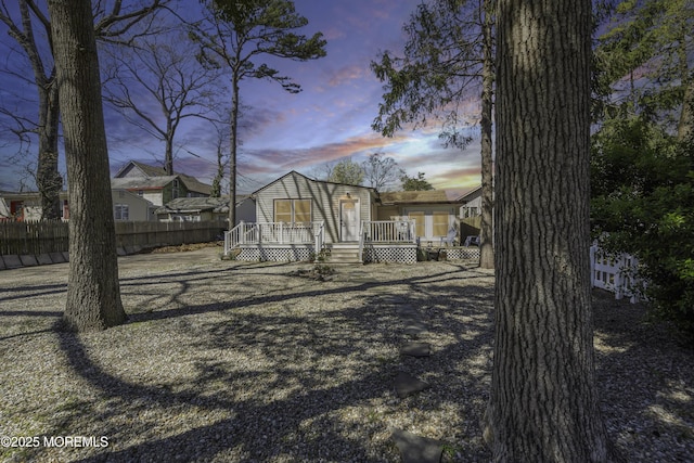 exterior space with fence and a deck