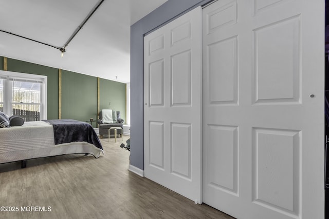 bedroom featuring wood finished floors