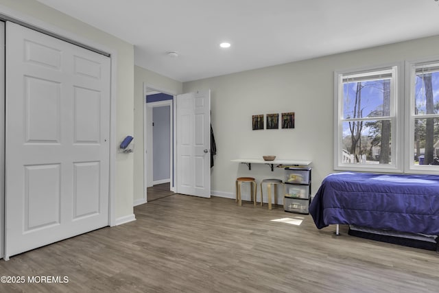 bedroom featuring recessed lighting, wood finished floors, and baseboards