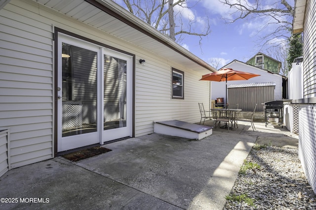 view of patio with outdoor dining area and area for grilling