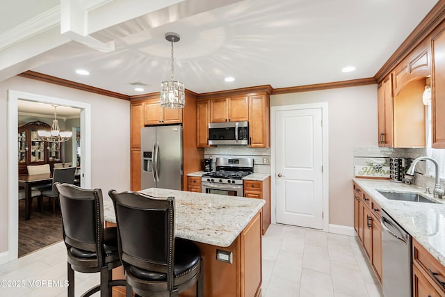 kitchen featuring appliances with stainless steel finishes, a sink, a chandelier, backsplash, and ornamental molding