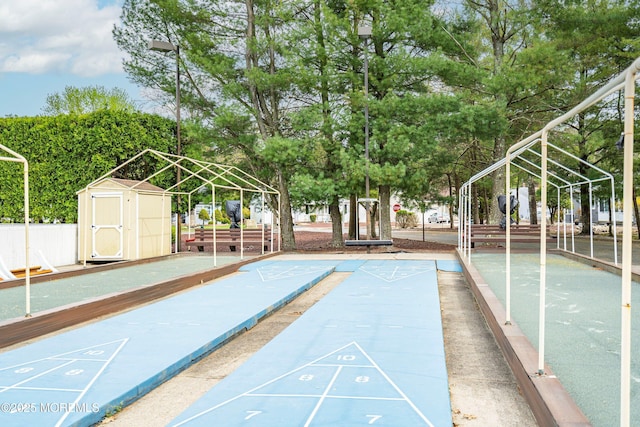 view of home's community featuring shuffleboard