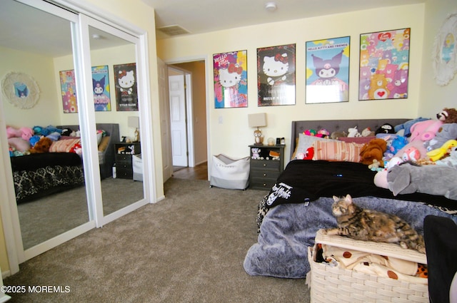 carpeted bedroom featuring visible vents
