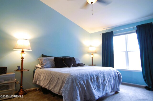 carpeted bedroom featuring baseboards, ceiling fan, and lofted ceiling