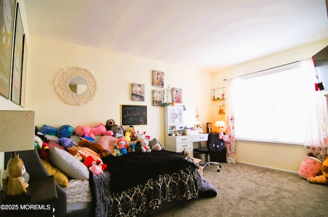 bedroom featuring carpet floors and baseboards