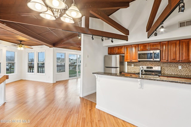 650 Front St, Union Beach, NJ 07735 - kitchen featuring decorative backsplash, appliances with stainless steel finishes, visible vents, and plenty of natural light