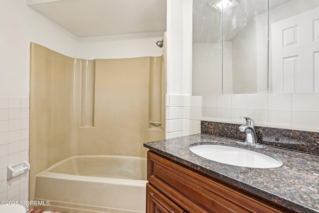 650 Front St, Union Beach, NJ 07735 - bathroom with tile walls, shower / bath combination, and vanity