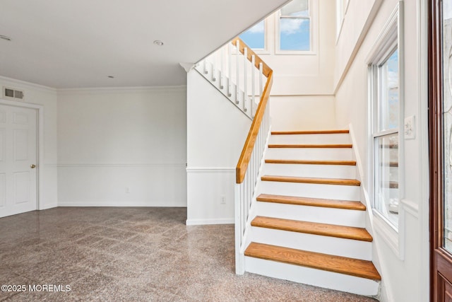 650 Front St, Union Beach, NJ 07735 - staircase featuring baseboards, visible vents, carpet, and crown molding