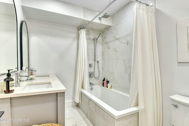 bathroom featuring a sink, tiled shower / bath combo, baseboards, toilet, and marble finish floor