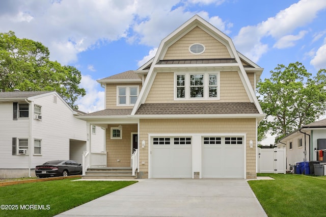 619 Mistletoe Ave, Point Pleasant, NJ 08742 - view of front of house with a gambrel roof, concrete driveway, a front yard, and a garage