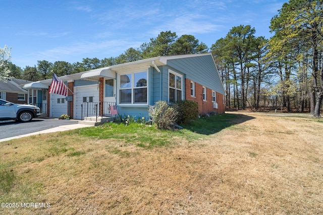 bungalow-style home with a front yard
