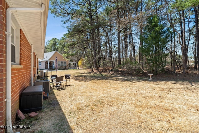 view of yard with central air condition unit