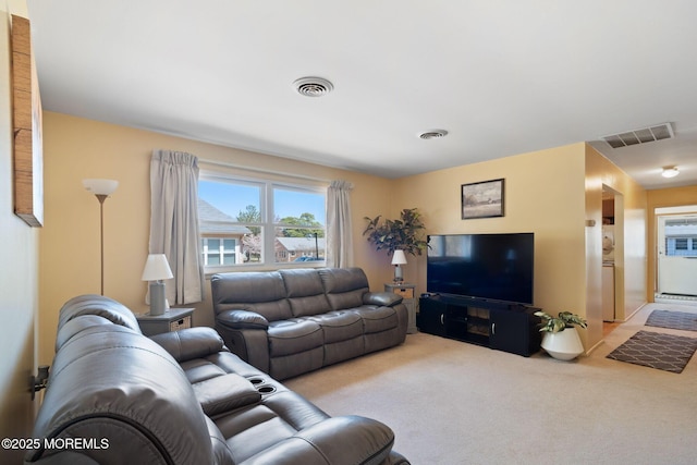 living room with visible vents and carpet flooring