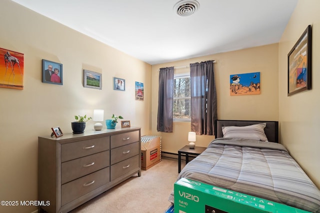 bedroom with visible vents, baseboard heating, and light carpet