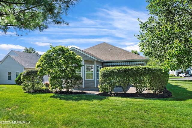 1507 Primrose Pl, Manasquan, NJ 08736 - back of property featuring a lawn and roof with shingles