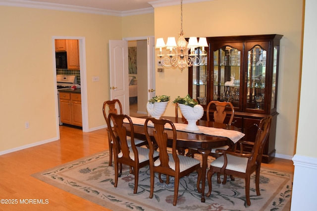 1507 Primrose Pl, Manasquan, NJ 08736 - dining space with a chandelier, light wood-style flooring, and ornamental molding
