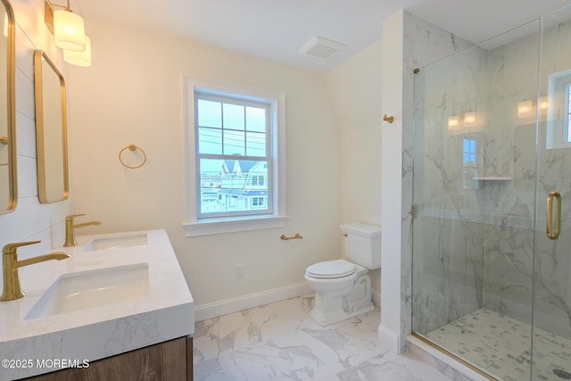 bathroom with marble finish flooring, toilet, a marble finish shower, baseboards, and double vanity