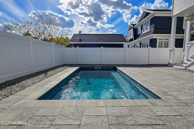 view of pool with a patio area and a fenced backyard