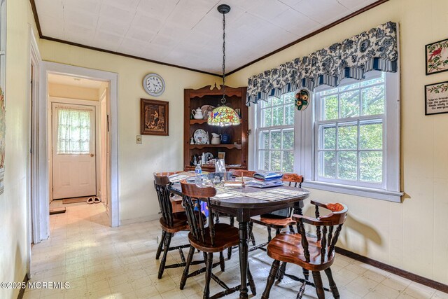 94 Topanemus Ln, Freehold, NJ 07728 - dining area featuring light flooring, baseboards, and crown molding