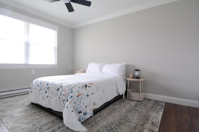 bedroom featuring baseboard heating, wood finished floors, ceiling fan, baseboards, and ornamental molding