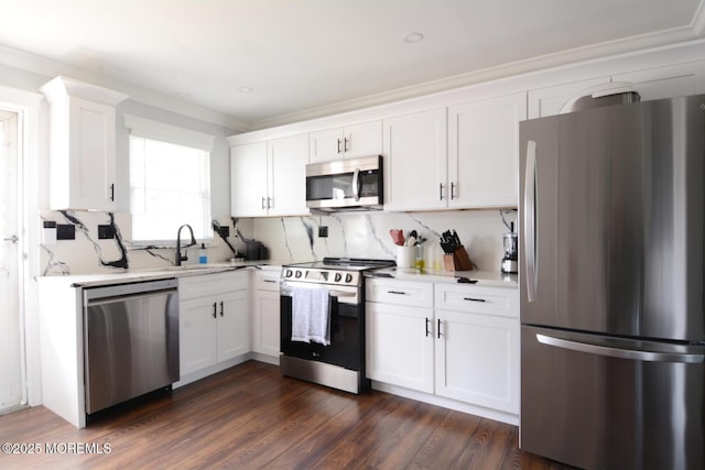 kitchen with light countertops, white cabinetry, and stainless steel appliances