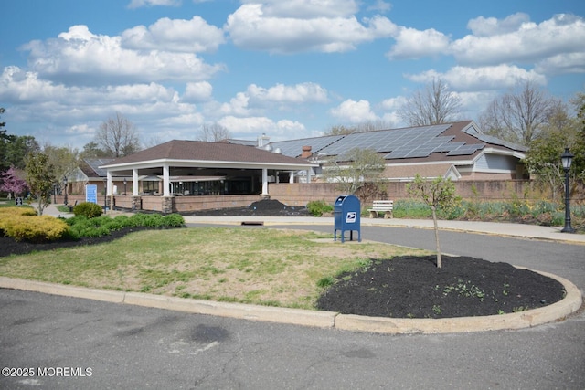 exterior space featuring a gazebo and fence