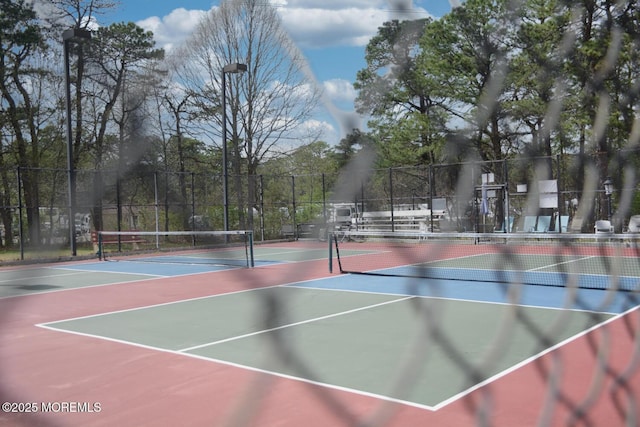 view of sport court with fence and community basketball court
