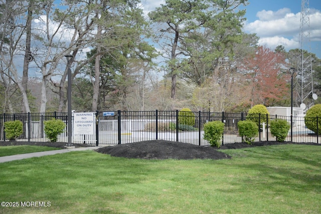 exterior space with a yard and fence