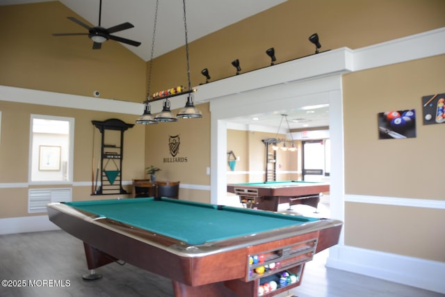 game room with wood finished floors, pool table, high vaulted ceiling, and a ceiling fan