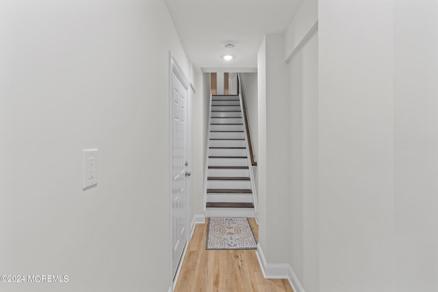 322 Lincoln Ave, Seaside Heights, NJ 08751 - hallway featuring stairway, baseboards, and light wood-style flooring