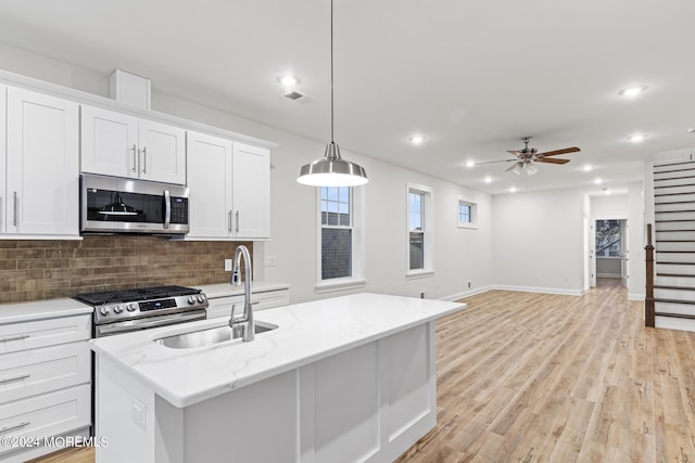 322 Lincoln Ave, Seaside Heights, NJ 08751 - kitchen with recessed lighting, stainless steel appliances, a sink, tasteful backsplash, and ceiling fan