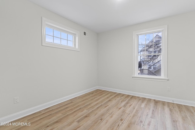 322 Lincoln Ave, Seaside Heights, NJ 08751 - unfurnished room with baseboards, visible vents, light wood-style floors, and a healthy amount of sunlight