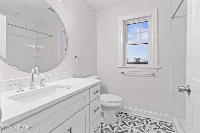 322 Lincoln Ave, Seaside Heights, NJ 08751 - full bath featuring visible vents, toilet, vanity, baseboards, and walk in shower