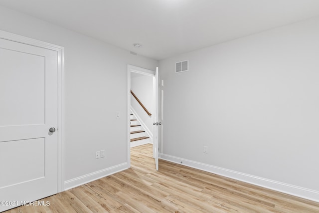 322 Lincoln Ave, Seaside Heights, NJ 08751 - spare room with light wood-type flooring, baseboards, visible vents, and stairs