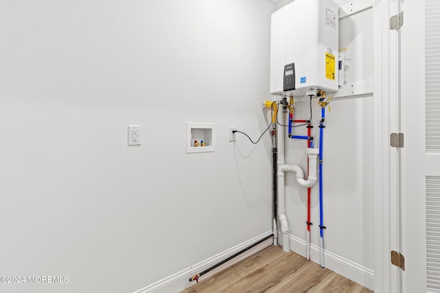322 Lincoln Ave, Seaside Heights, NJ 08751 - laundry area featuring light wood finished floors, baseboards, tankless water heater, and hookup for a washing machine