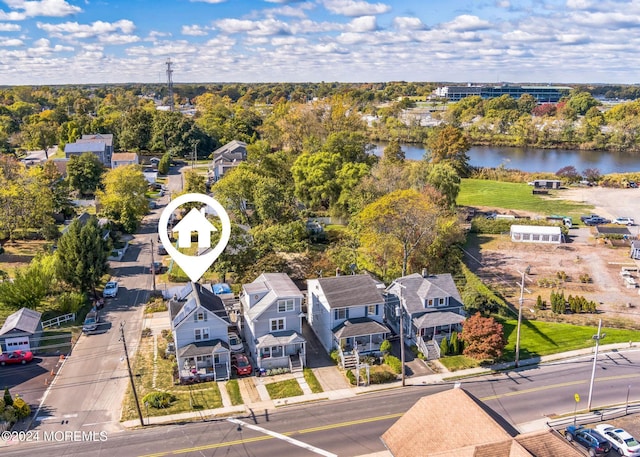 aerial view with a residential view and a water view