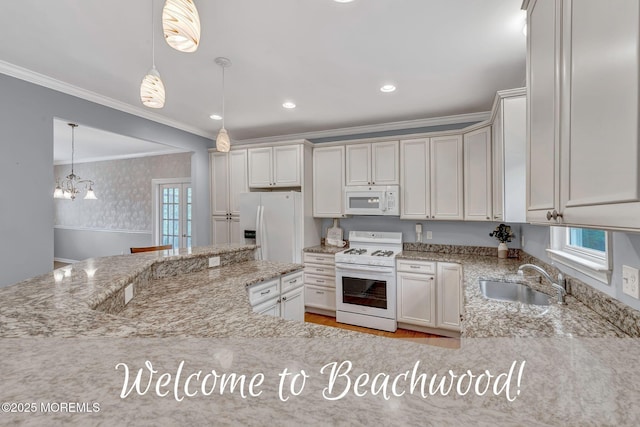 kitchen with white appliances, a sink, crown molding, light stone countertops, and pendant lighting