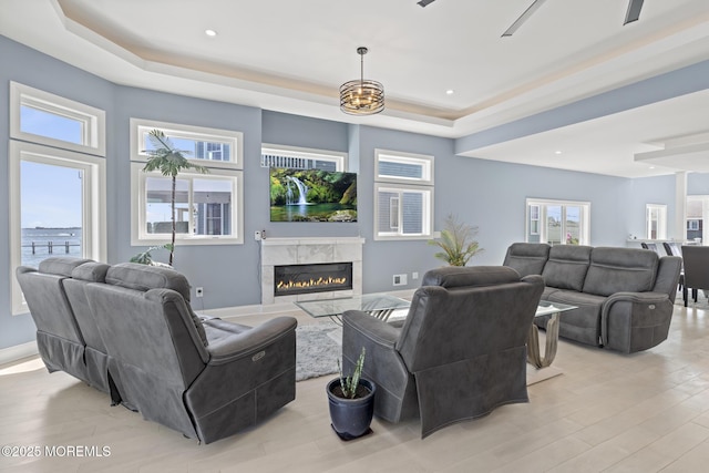 107 Bay Shore Dr, Toms River, NJ 08753 - living area with a fireplace, light wood-type flooring, baseboards, a tray ceiling, and recessed lighting