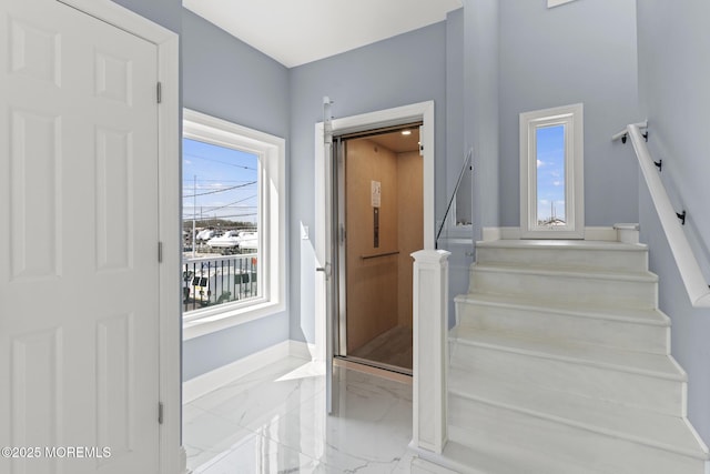 107 Bay Shore Dr, Toms River, NJ 08753 - staircase featuring baseboards, a healthy amount of sunlight, and marble finish floor